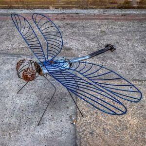 A sculpture of a dragonfly made in metal by Jan & Geoff Arts