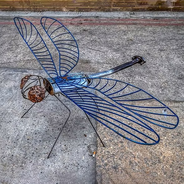 A sculpture of a dragonfly made in metal by Jan & Geoff Arts