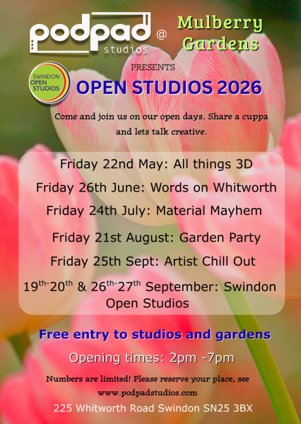 A photograph of pink tulips on a green background.