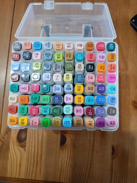 A box of coloured pens
