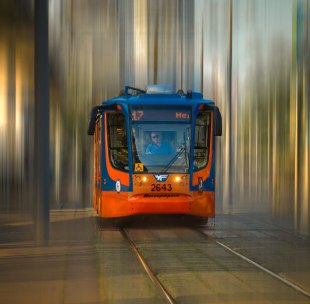 A styalised photograph of a red and blue tram